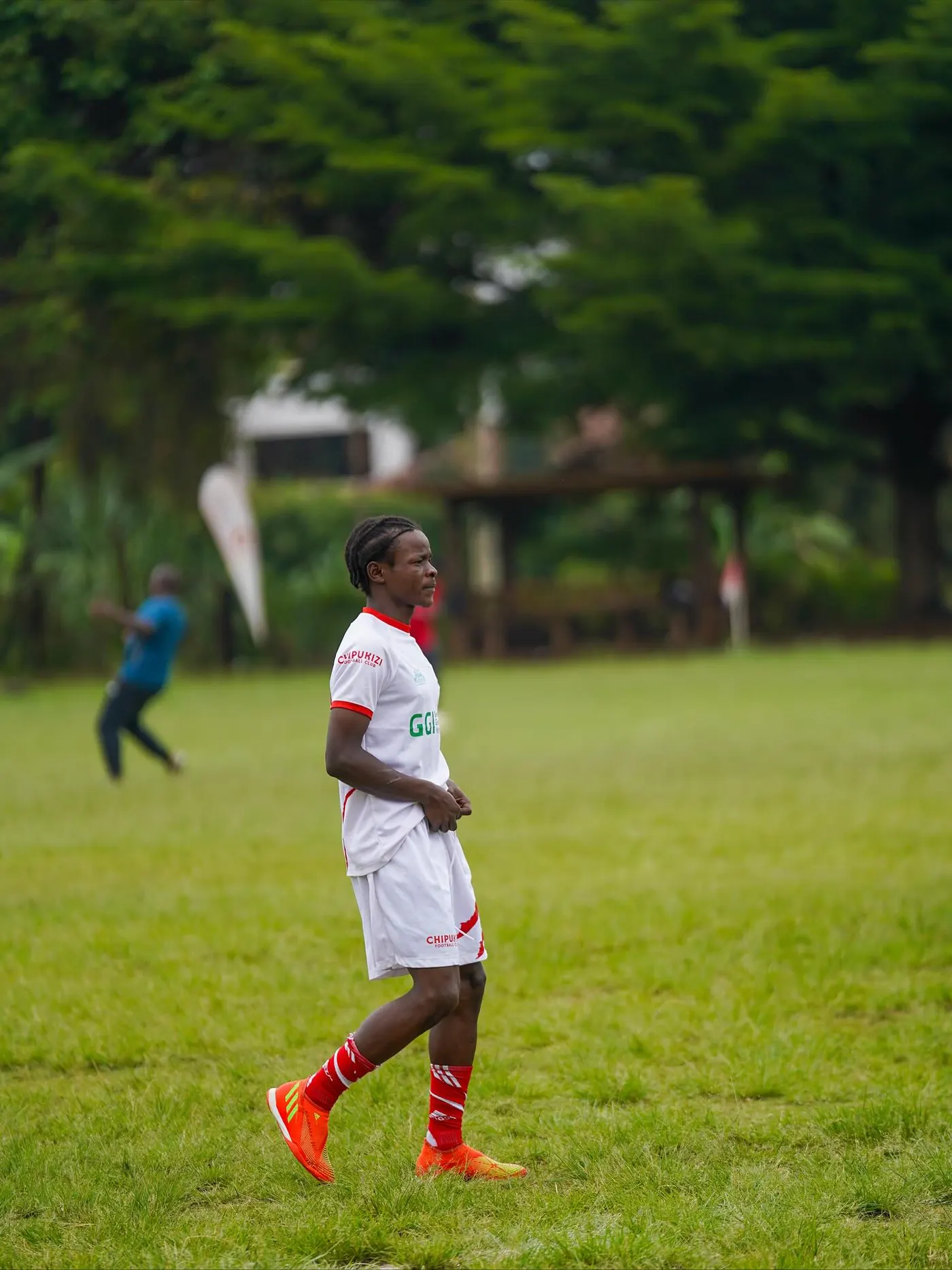 Chipukizi FC players warming up before kickoff.