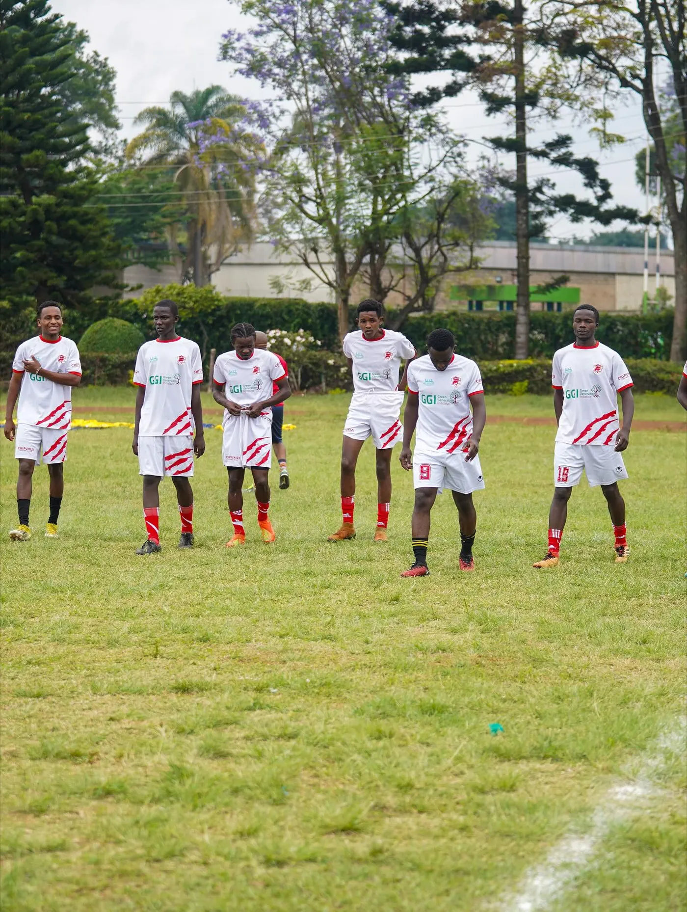 Chipukizi FC players warming up before kickoff.
