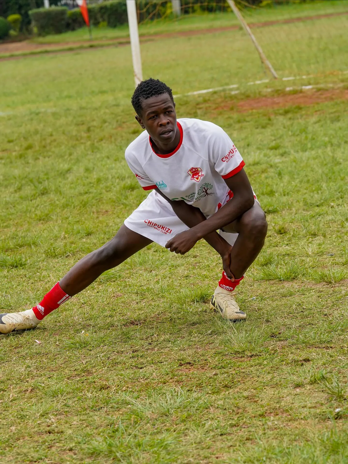 Chipukizi FC players warming up before kickoff.
