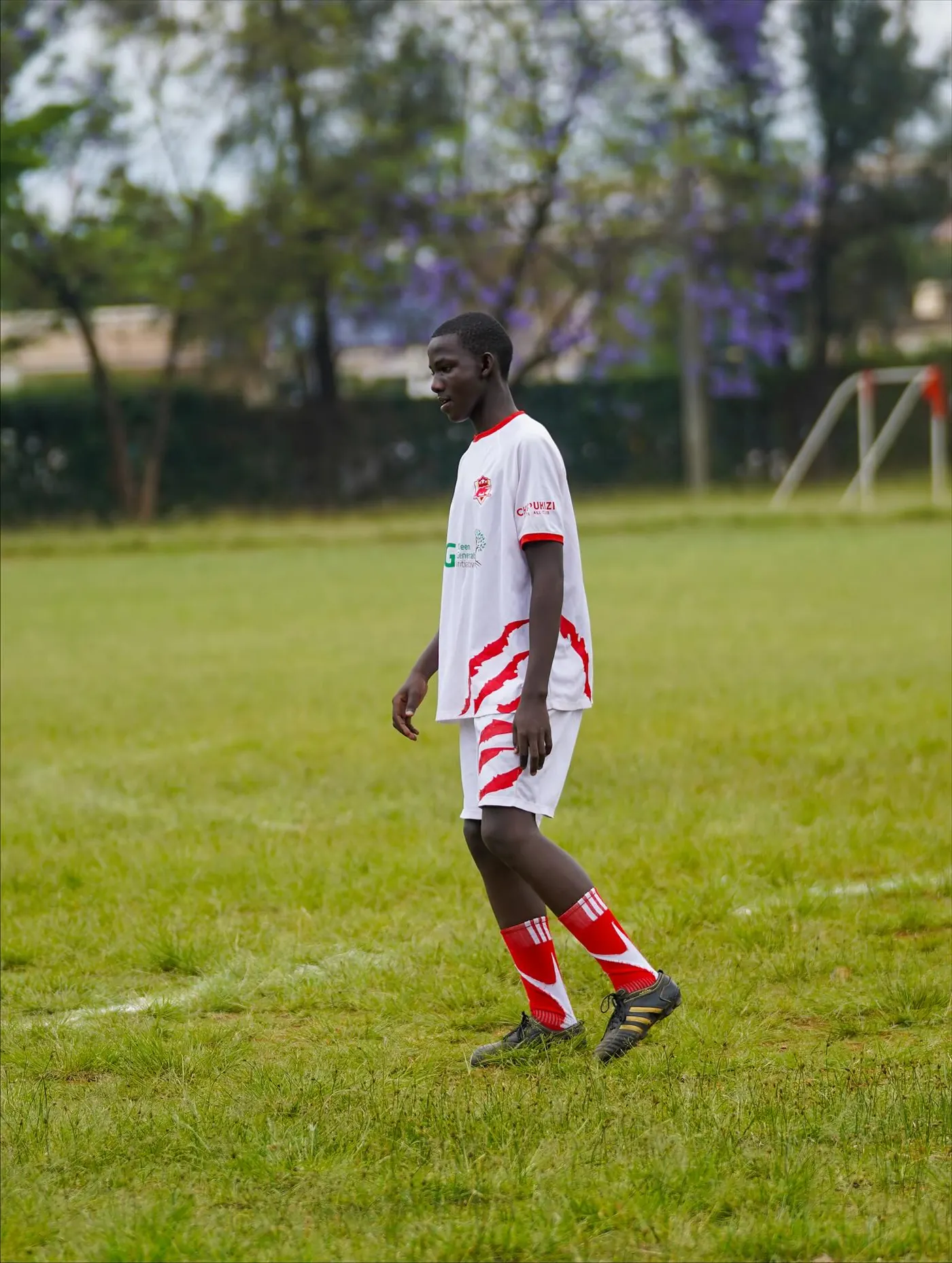Chipukizi FC players warming up before kickoff.