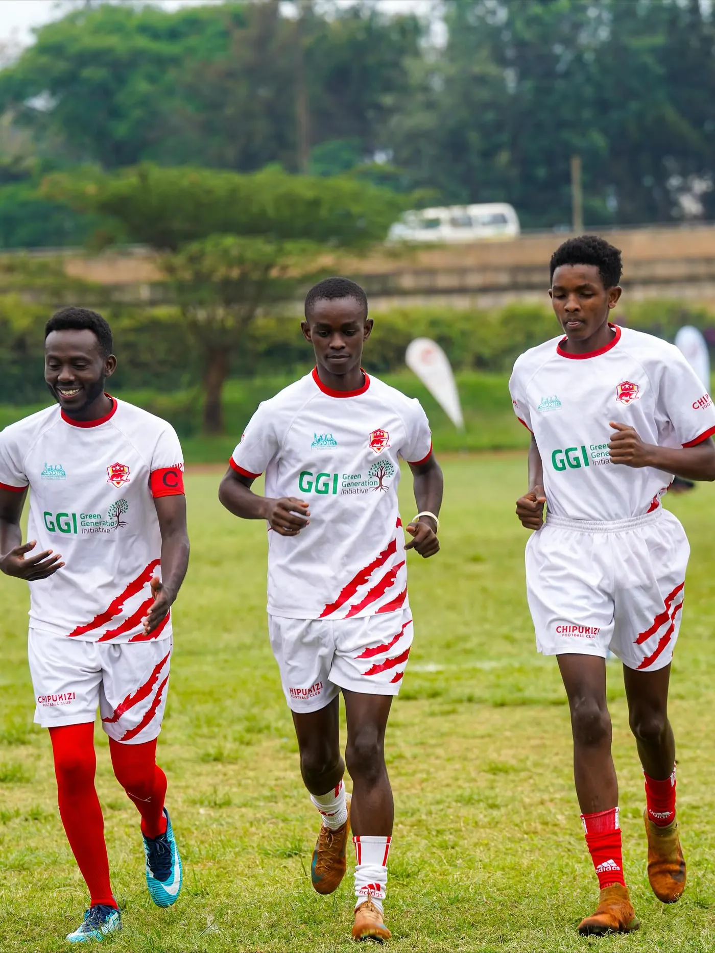 Chipukizi FC players warming up before kickoff.