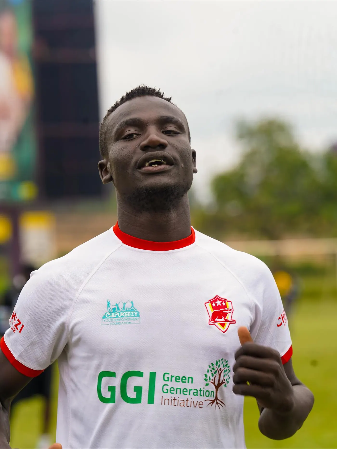 Chipukizi FC players warming up before kickoff.