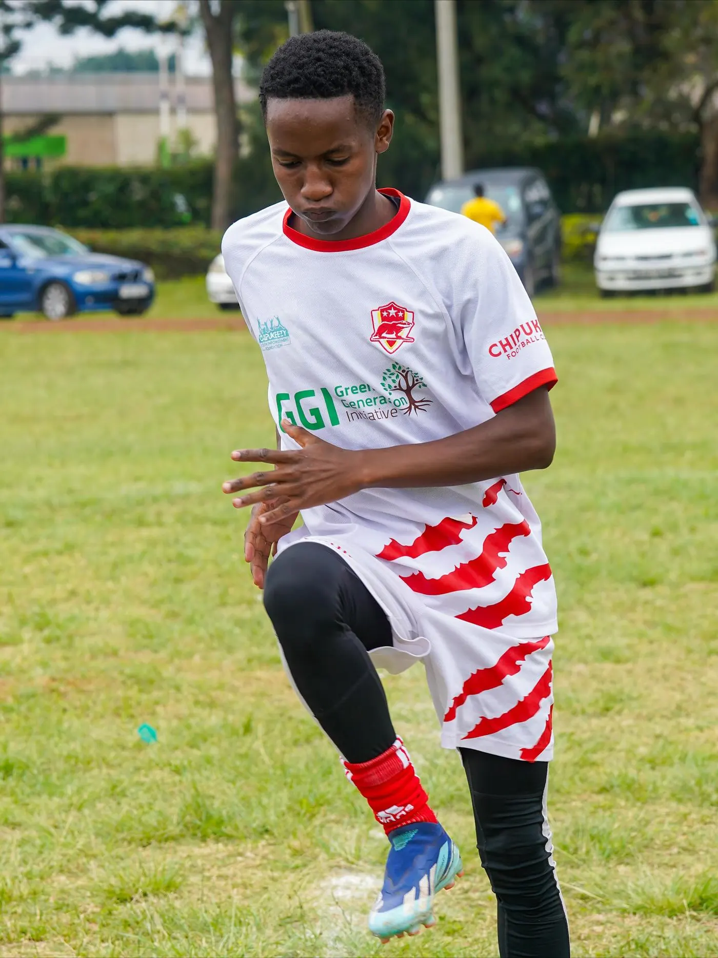 Chipukizi FC players warming up before kickoff.