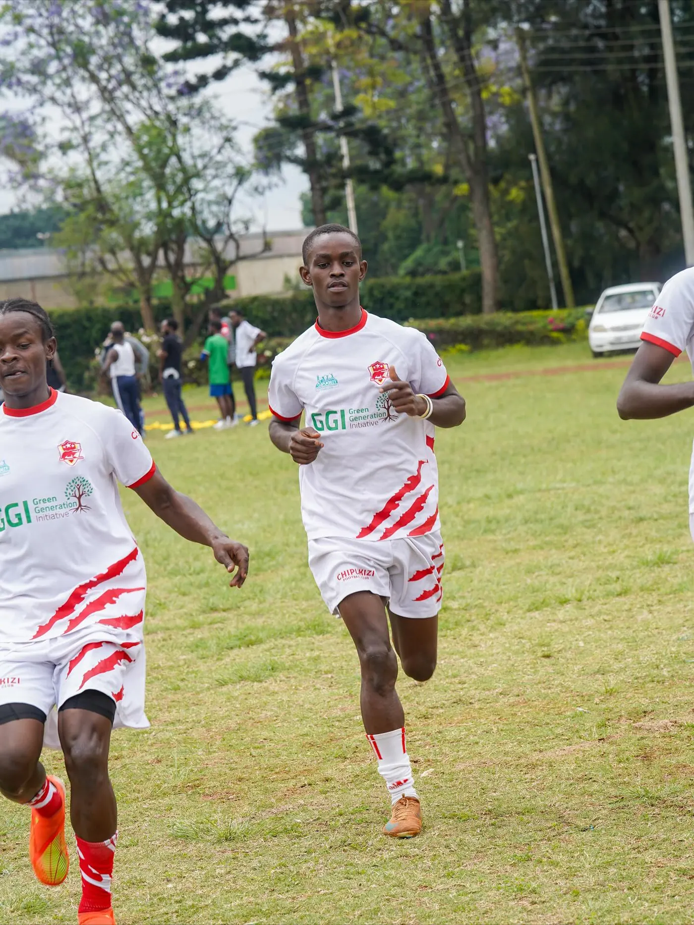 Chipukizi FC players warming up before kickoff.