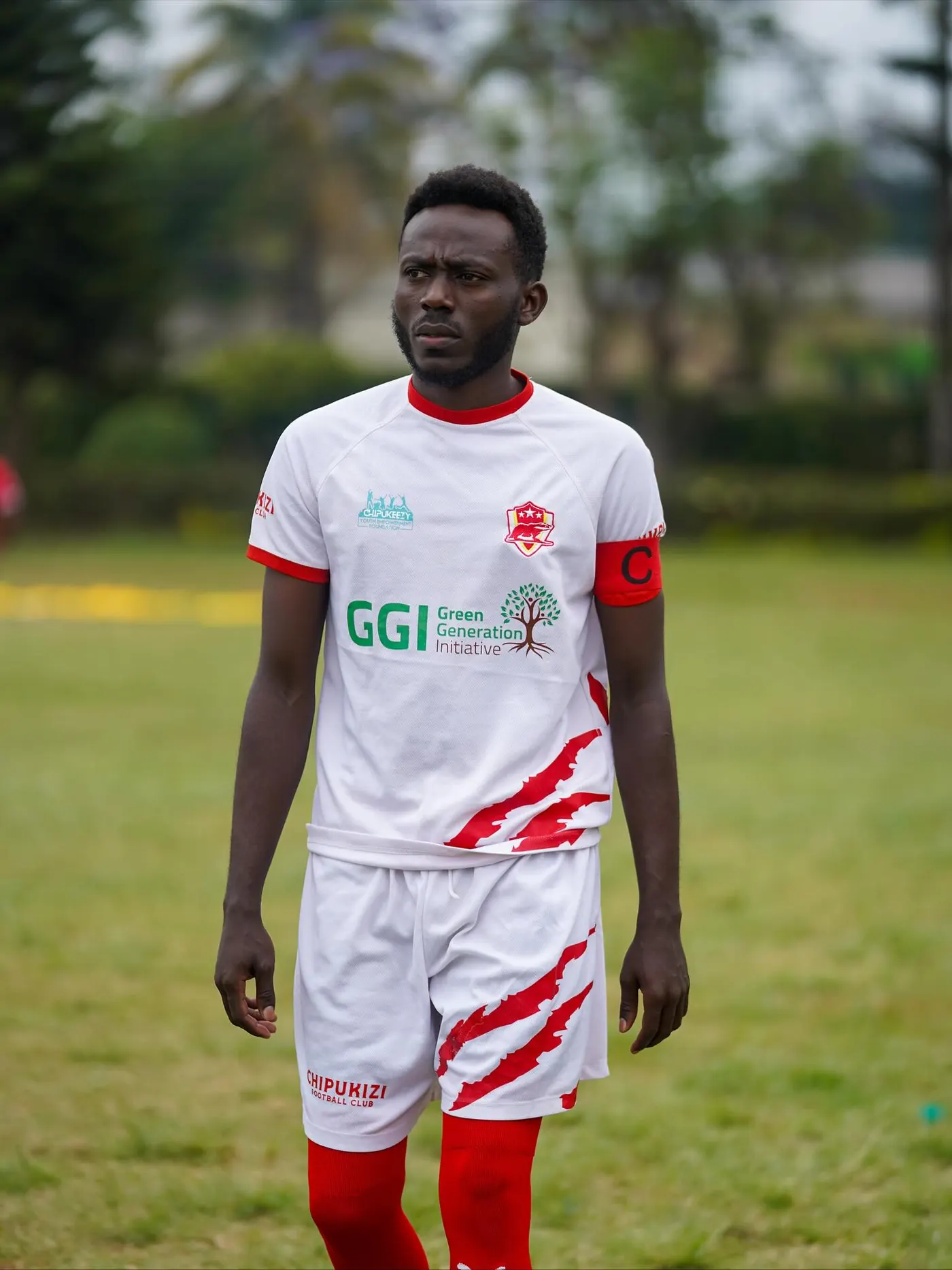 Chipukizi FC players warming up before kickoff.