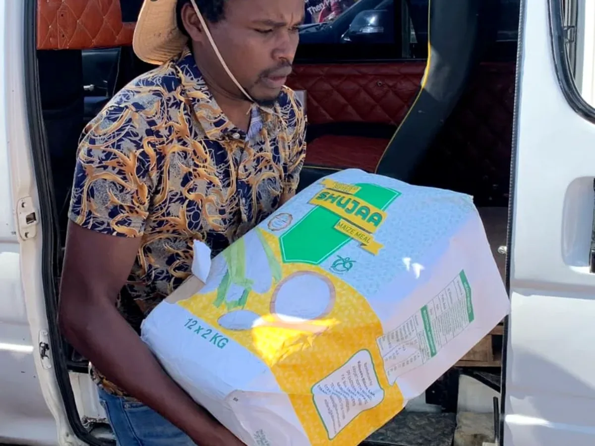 Education support boxes being moved during a community resource delivery activity