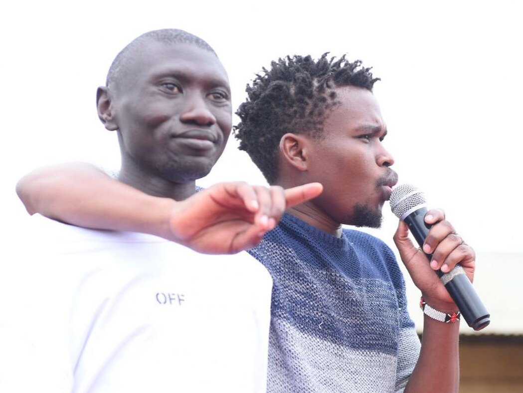 Stivo Simple Boy speaking into a microphone alongside Chipukeezy